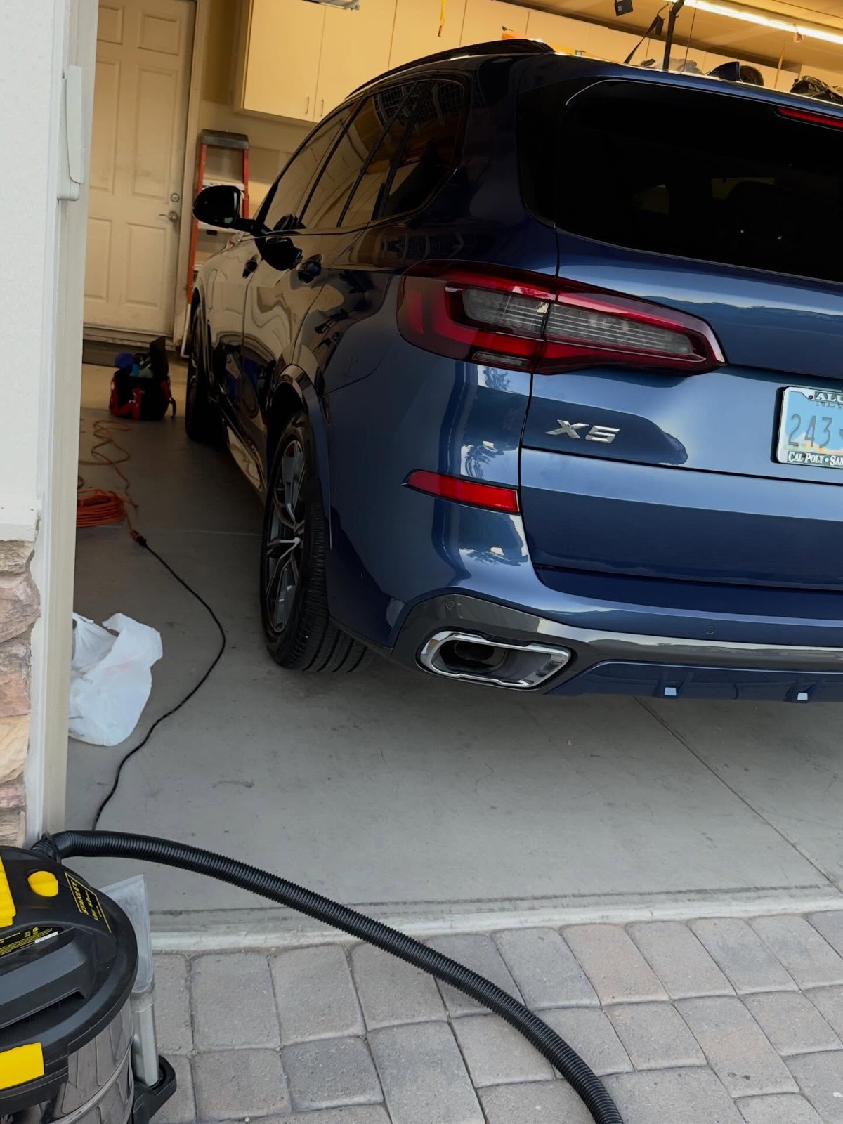 Blue BMW X5 rear after a full detail