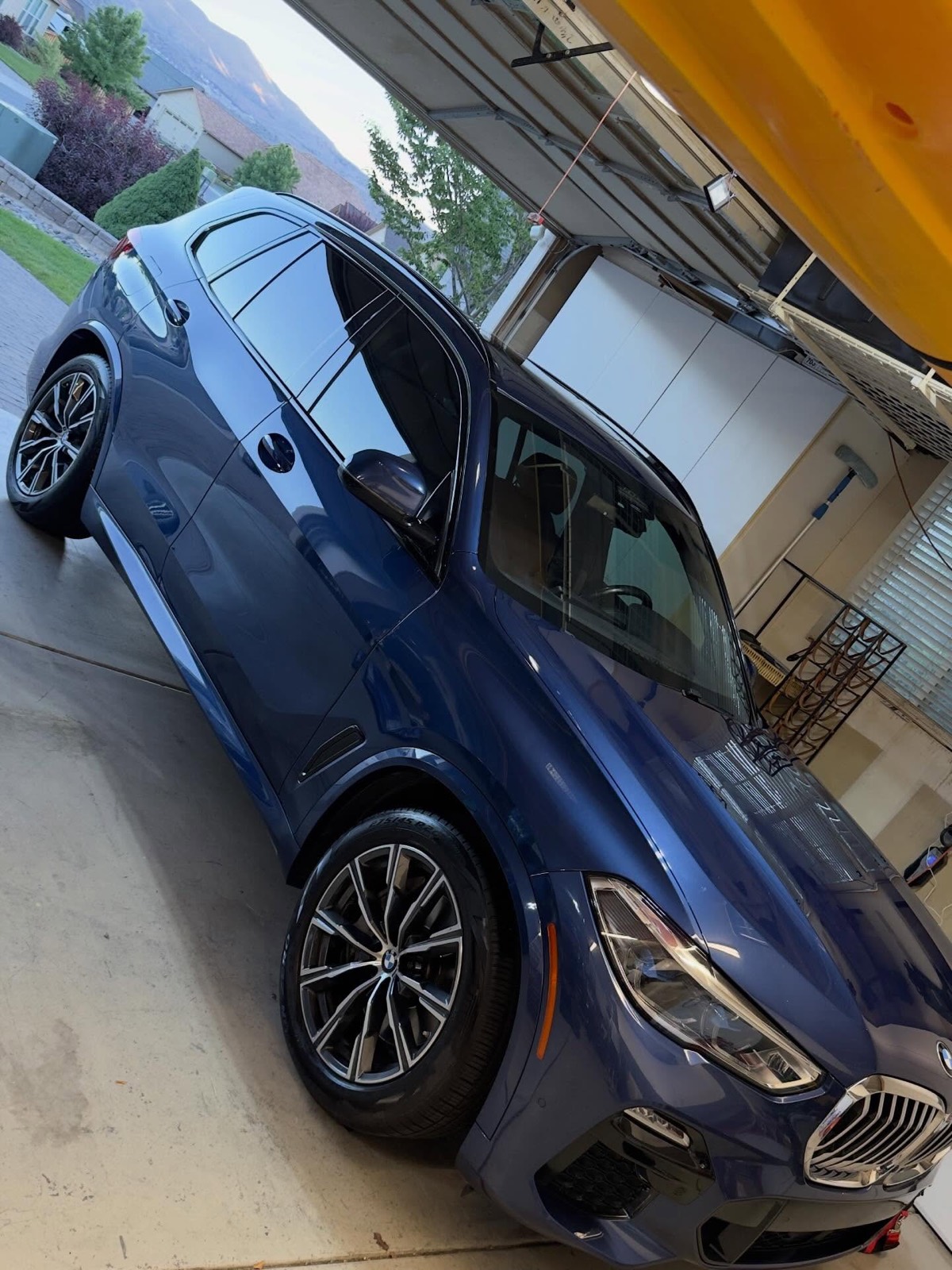Blue BMW X5 side profile