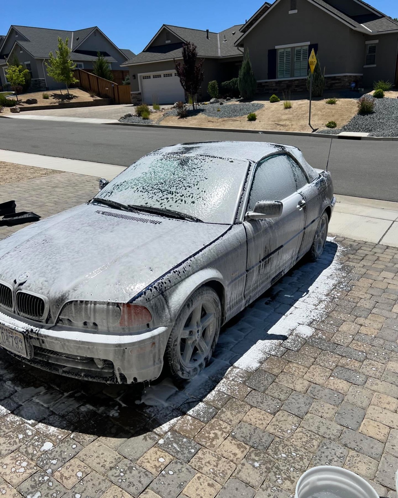 BMW 3-series covered in foam during a wash