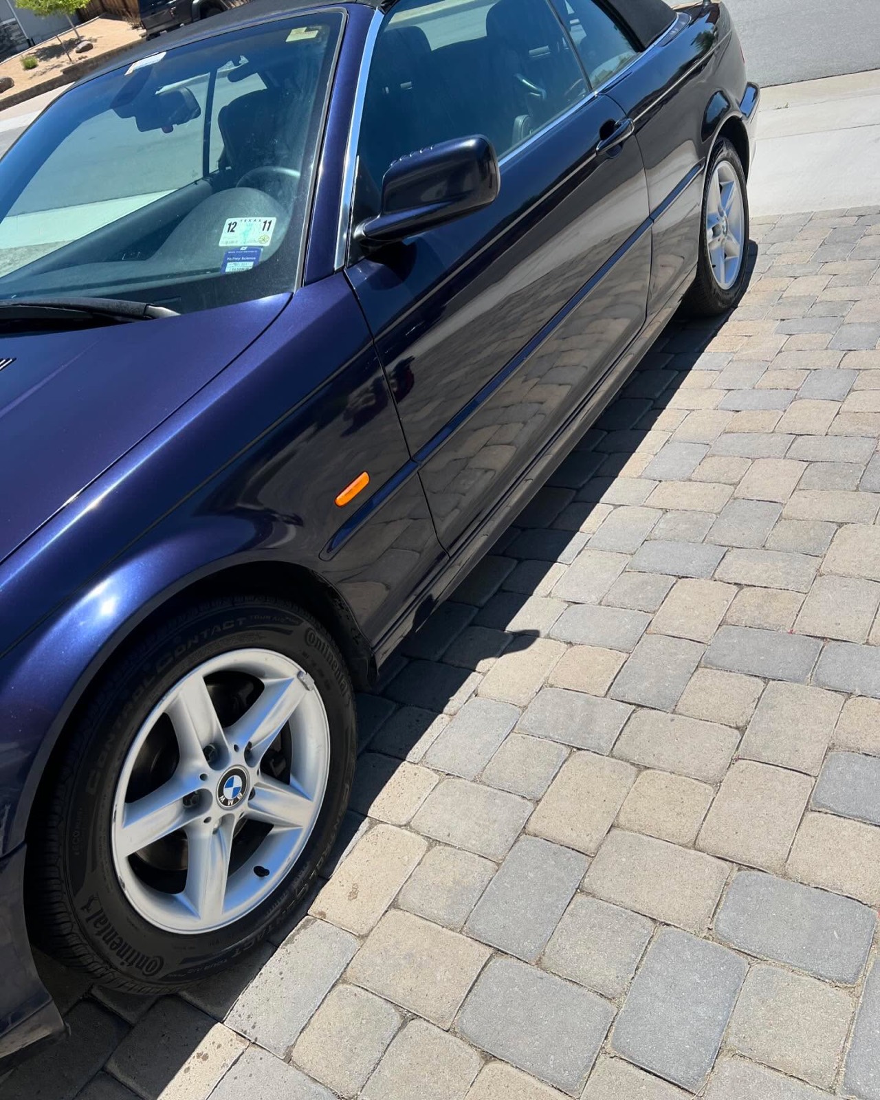 Dark blue BMW 3-series side and wheel after detailing