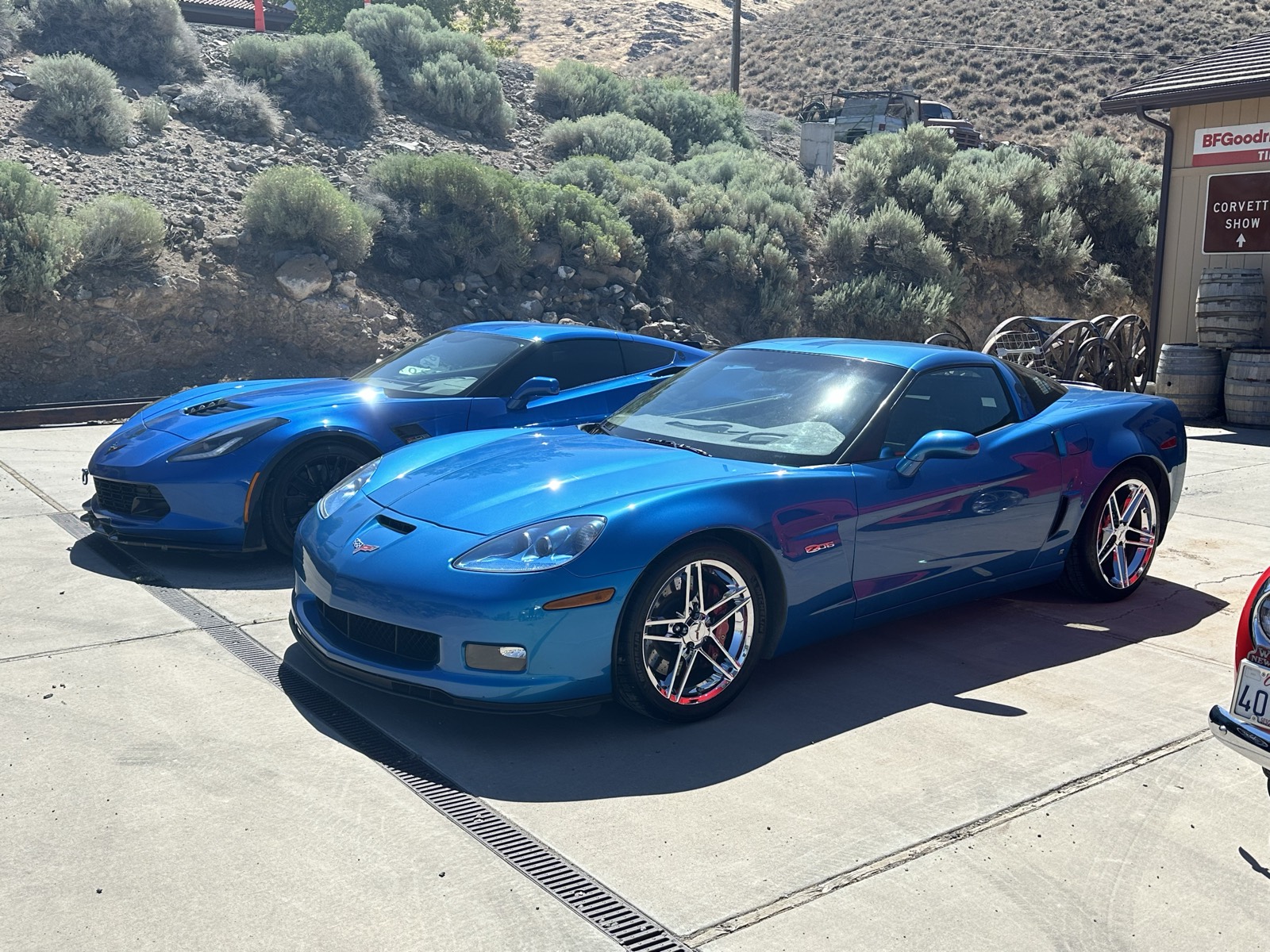 Blue C6 Corvette front three-quarter at a car show, deep gloss finish