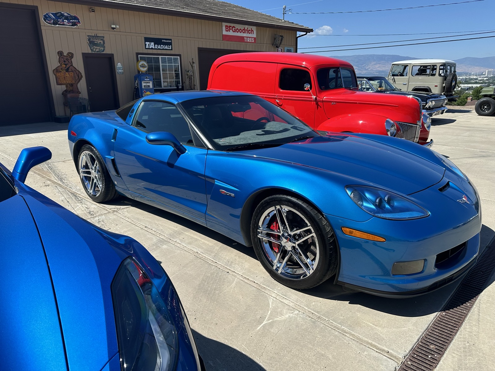 Blue C6 Corvette front three-quarter outside the shop after detailing