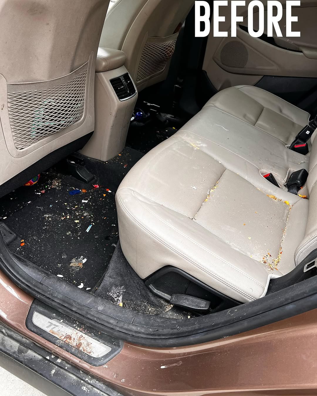 Hyundai rear seats before detailing — crumbs and debris on the seat and floor