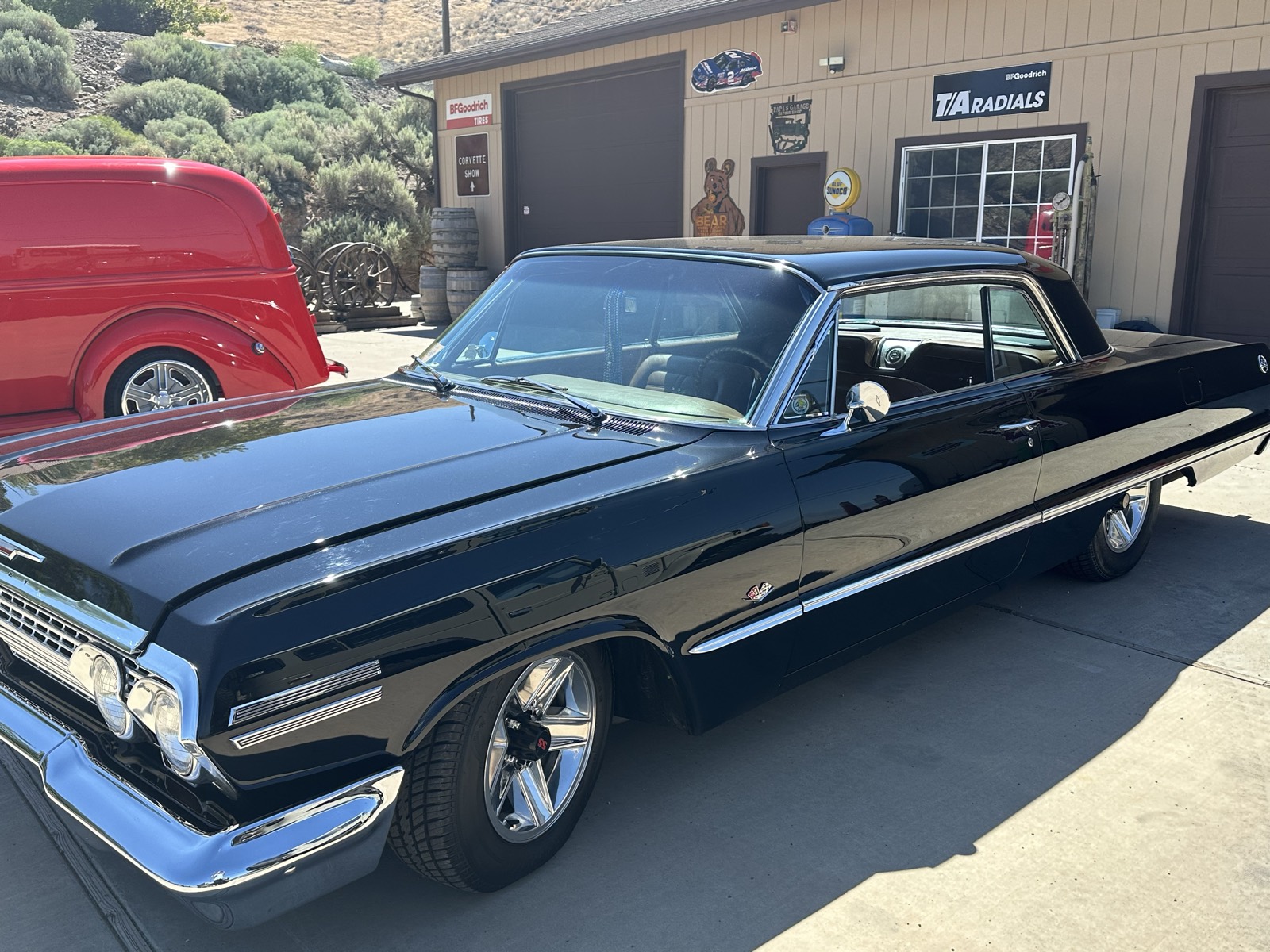 Classic Impala front three-quarter, glossy black paint