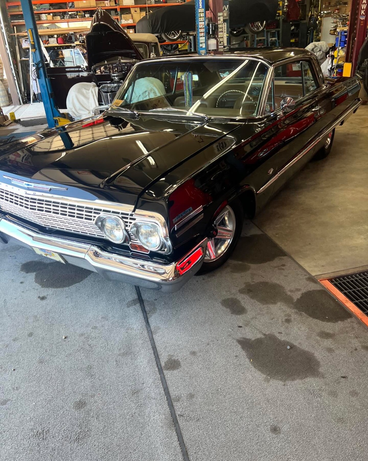 Classic black Chevrolet Impala front after detailing