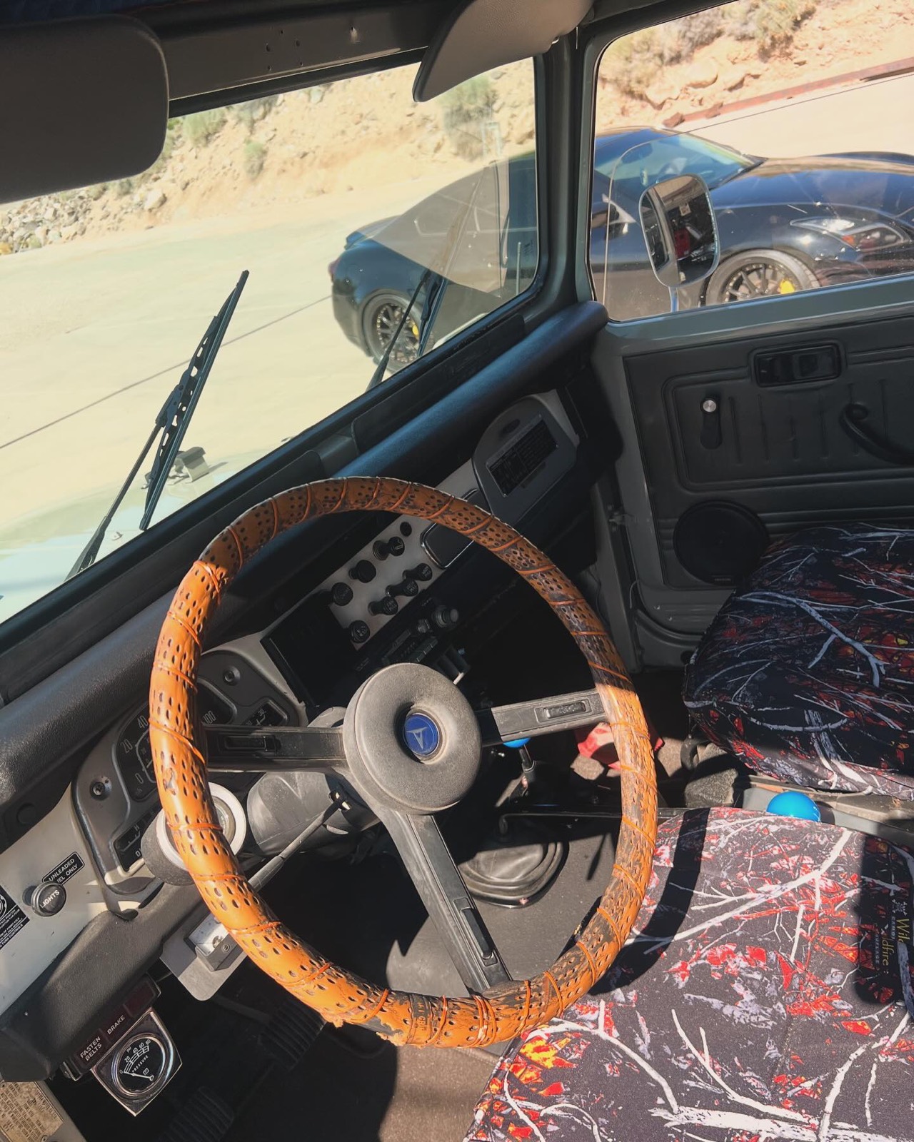 Land Cruiser interior with wood steering wheel after detailing