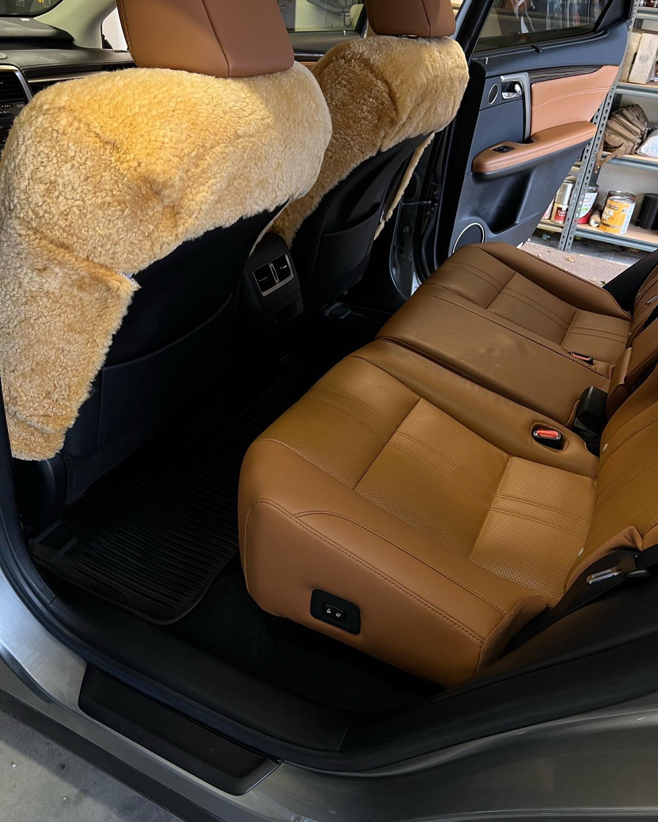 Lexus RX rear leather seats with sheepskin covers during detailing