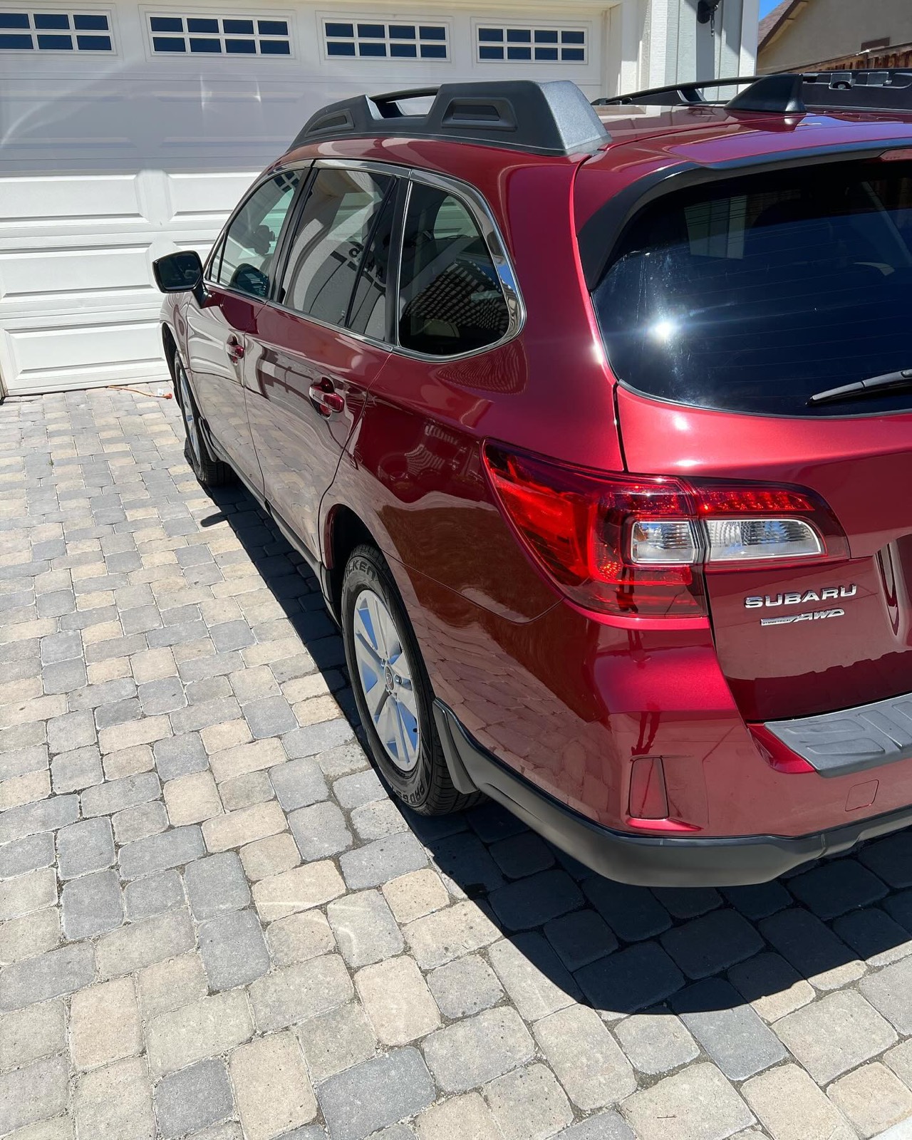 Red Subaru Outback rear after detailing