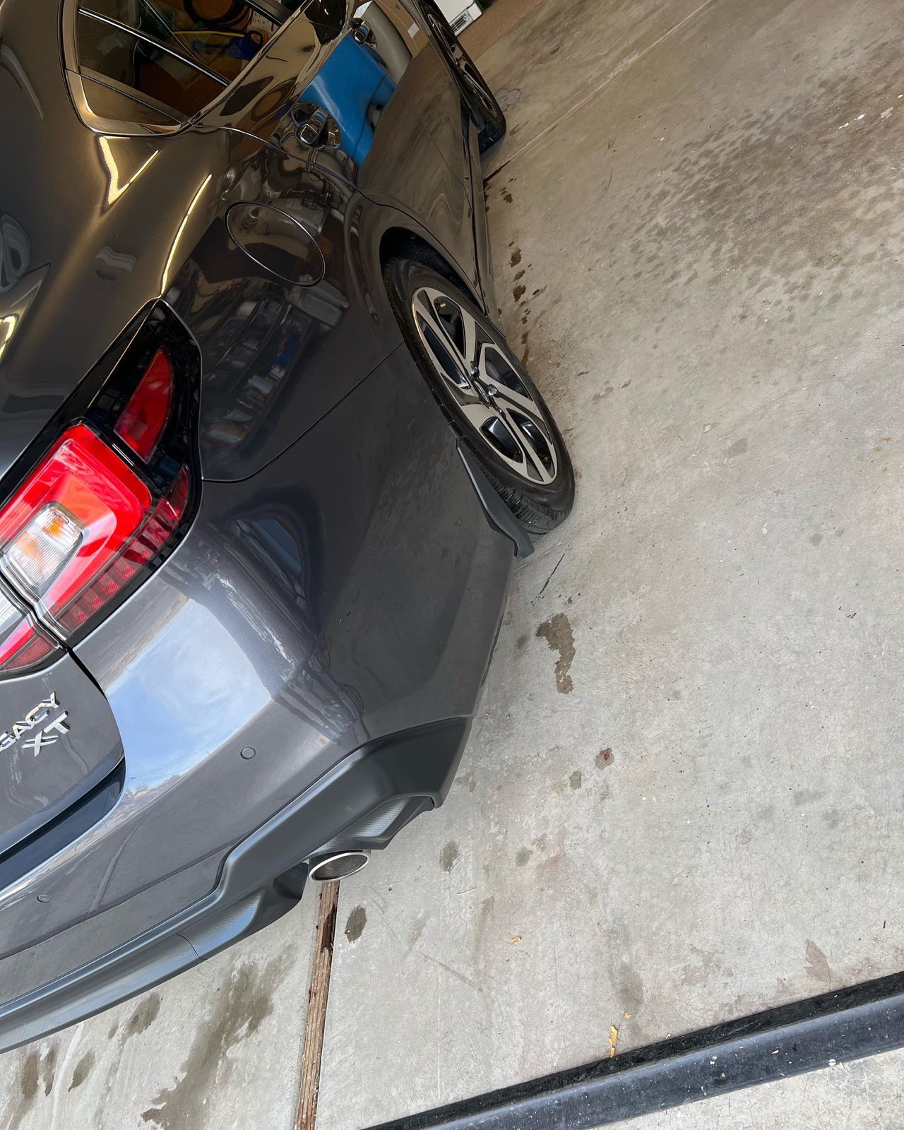 Gray Subaru rear three-quarter after detailing